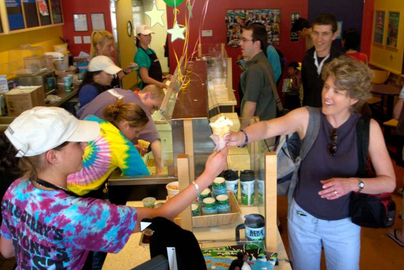 DENVER, COLO. - APRIL 19, 2005 - Customers line up at a free ice cream giveaway at Ben &amp; Jerry's, 2339 E. Evans Ave., across from the University of Denver campus. The store had given away some 3,000 cups or cones by 3 p.m. Tuesday afternoon, 4/19/05. (Jer