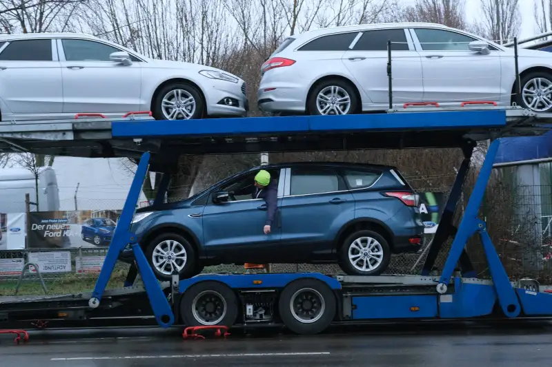 three-cars-being-towed