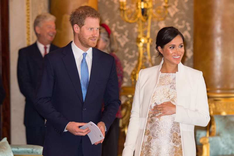 Meghan, Duchess of Sussex, and Prince Harry, Duke of Sussex, attend a reception to mark the 50th anniversary of the investiture of the Prince of Wales at Buckingham Palace on March 5, 2019 in London, England.
