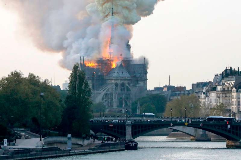 Flames rise during a fire at the landmark Notre-Dame Cathedral in central Paris on April 15, 2019.