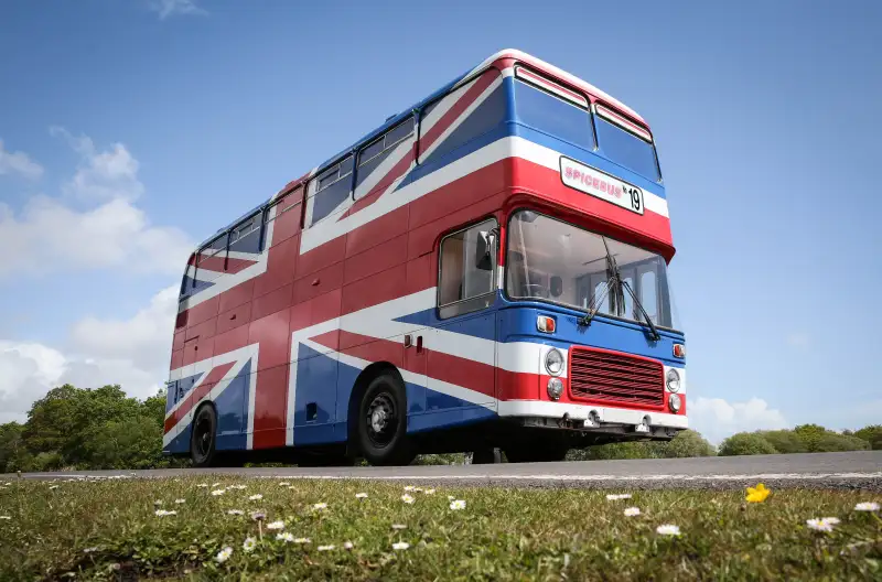 EDITORIAL USE ONLYMega-fan Suzanne Godley is listing the original Union Jack-painted Spice Bus from the 1997 movie Spice World on Airbnb, where itÕll be available for guests to book an overnight stay onboard on 14th and 15th June at Wembley Park in London. PRESS ASSOCIATION Photo. Issue date: Wednesday May 15, 2019. The recently renovated living area features pink Union Jack cinema chairs below a ÔGirl PowerÕ neon light installation, and is fully stocked with vintage 90s magazines and CDs to help recreate the 90s era. Upstairs thereÕs a dressing area and an adjoining bedroom, fitted with animal-print carpet and bedding for three guests. To view the Spice Bus listing on Airbnb, visit https://www.airbnb.co.uk/rooms/34270765 Photo credit should read: Matt Alexander/PA Wire