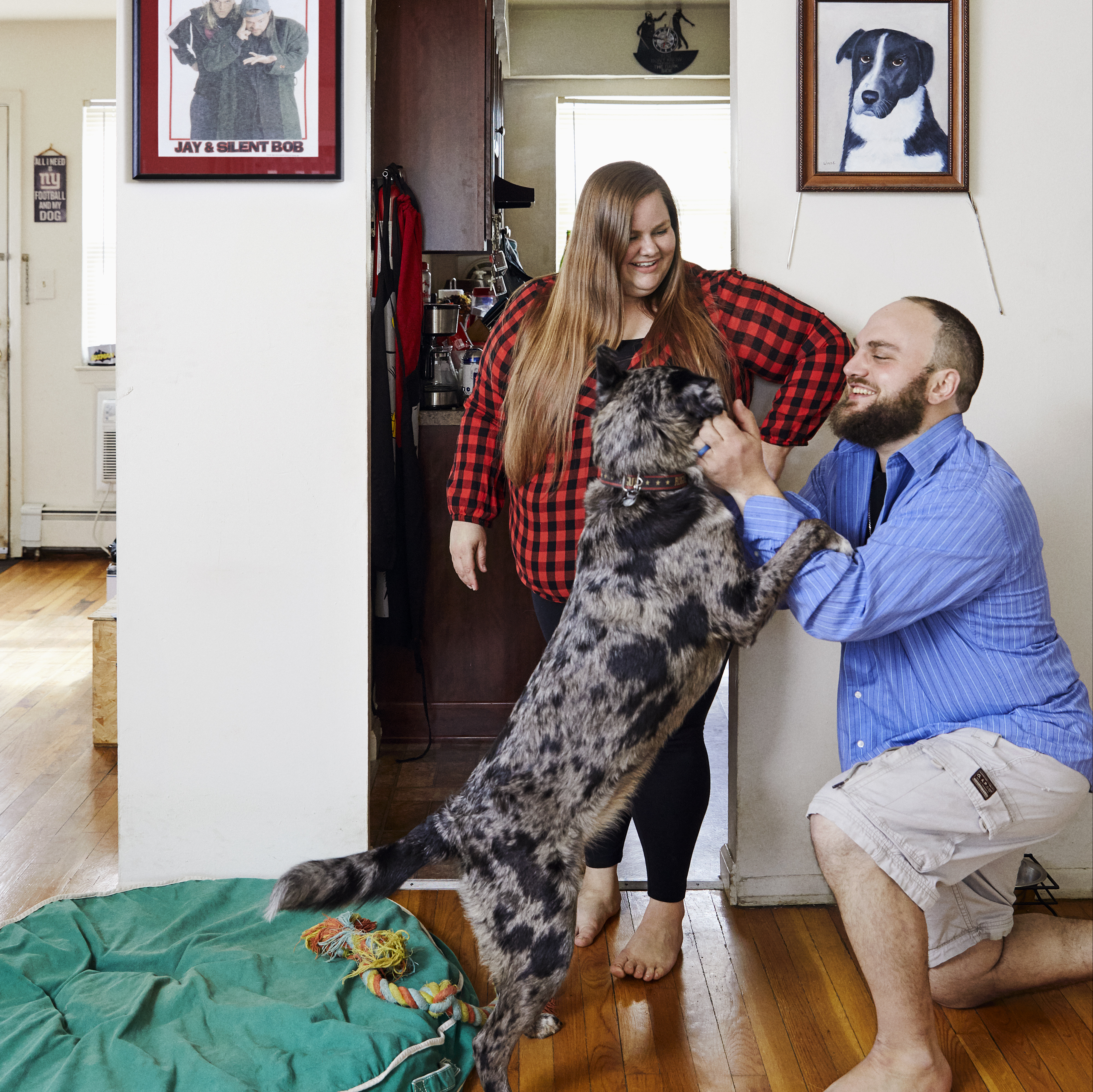 KC and Ryan in their house with their dog