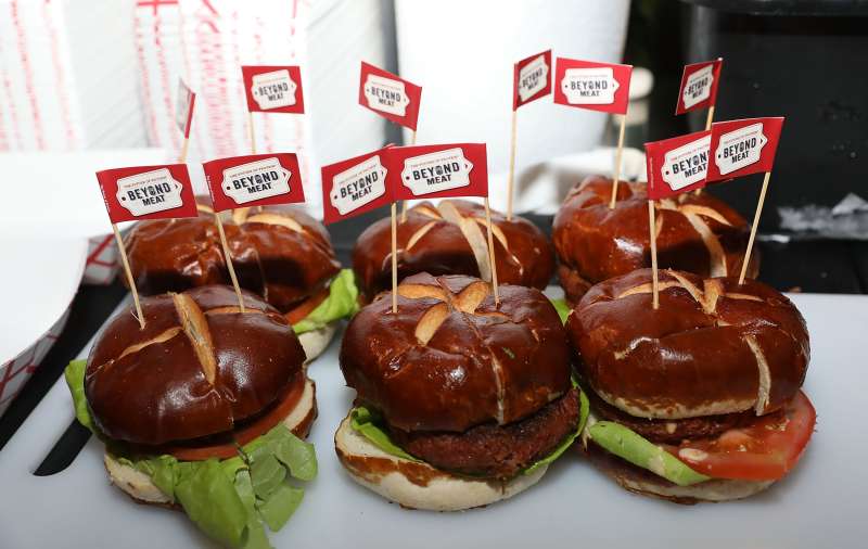 The Beyond Burger from Beyond Meat is Served At Al Roker’s Booth at the Heinken Light Burger Bash Presented by Schweid &amp; Sons Hosted by Rachael Ray