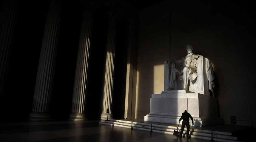 A cleaner sweeps the floor in front of the Lincoln Memorial in Washington, D.C., U.S. April 30, 2019.