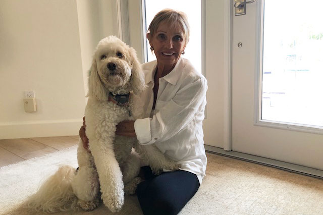 Lois Raynow takes CBD and also gives it to her 9-year-old Labradoodle, Daisy