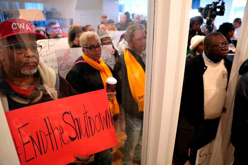 Members of the Communications Workers of America union, joined in a rally for furloughed federal workers at Congressman Lacy Clay's south St. Louis office on Friday, Jan. 25, 2019.