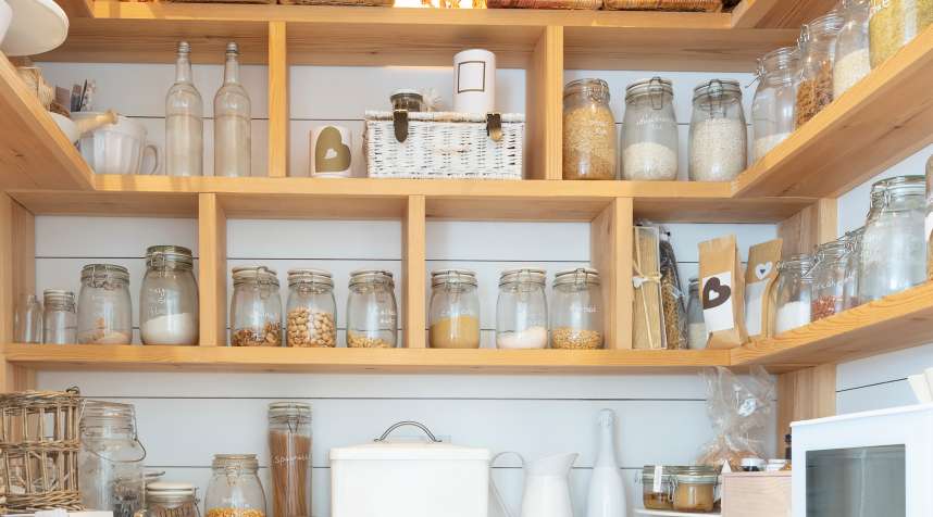 Woven baskets and food jars in pantry