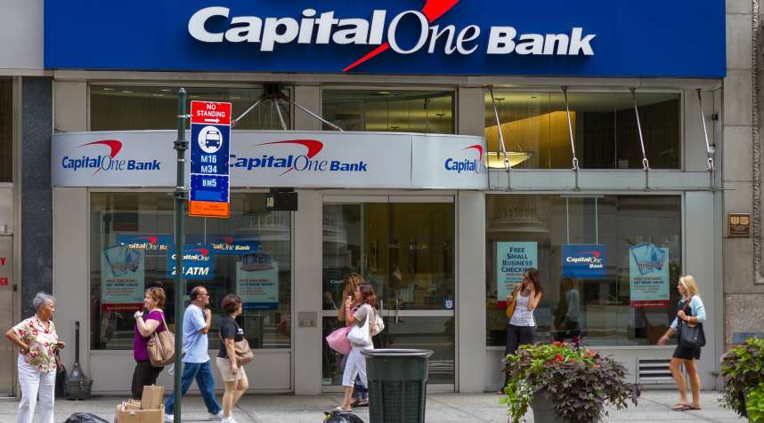 People stand in front of a Bank branch of Capital One Bank in New York City;