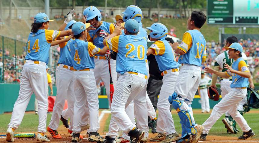 The team from Honolulu, Hawaii, celebrates a home run en route to their championship win at the 2018 Little League World Series in South Williamsport, Pennsylvania.