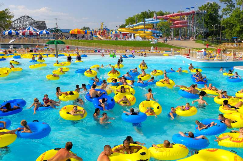 Many people in a lazy river on blue and yellow inner tubes in Bowling Green, Kentucky