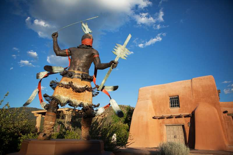 Pueblo style home and sculpture in Santa Fe, New Mexico