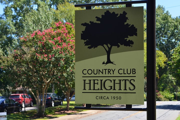 Sign at the entrance of neighborhood reading 'Country Club Heights'