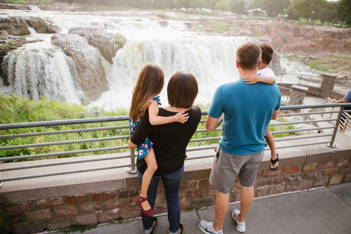 Family of four overlooking the falls in Sioux Falls, South Dakota