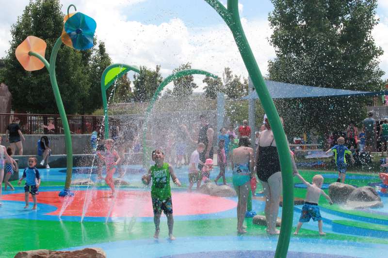 children and parents playing at a water park in Centennial, Colorado