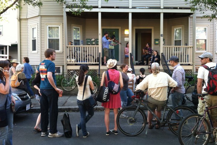 Neighbors gathered outside a house for a party in Somerville, Massachusetts