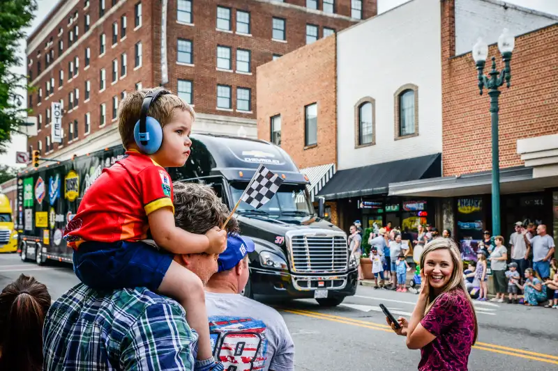 Boy on dad's shoulders in downtown Concord, North Carolina