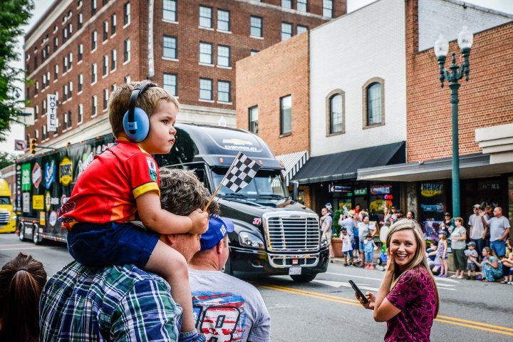 Boy on dad's shoulders in downtown Concord, North Carolina