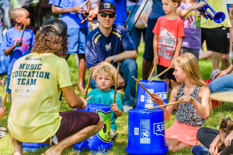 Children performing music with buckets in Appleton, Wisconsin