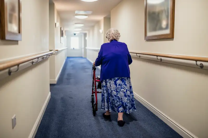 Senior Woman with Walker in a Care Home