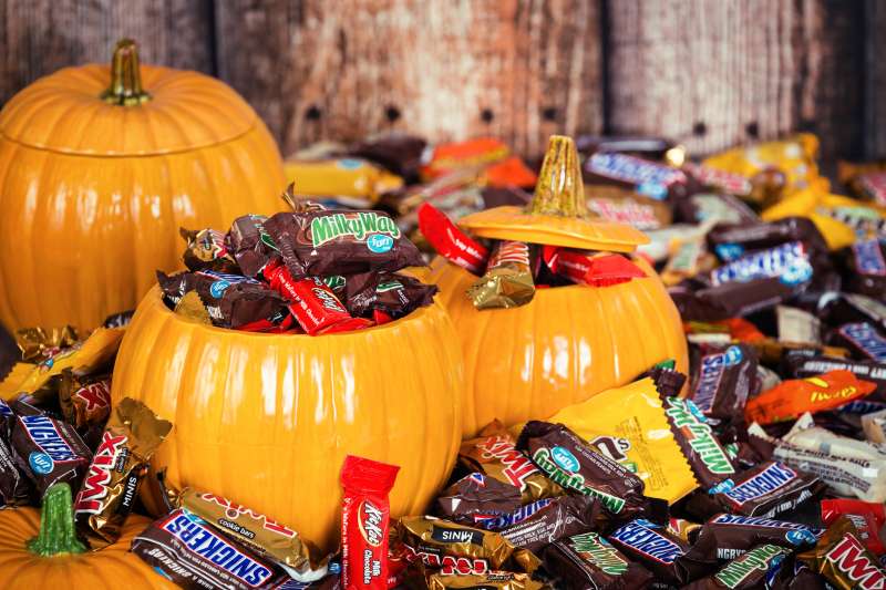 Decorative pumpkins filled with Halloween candy