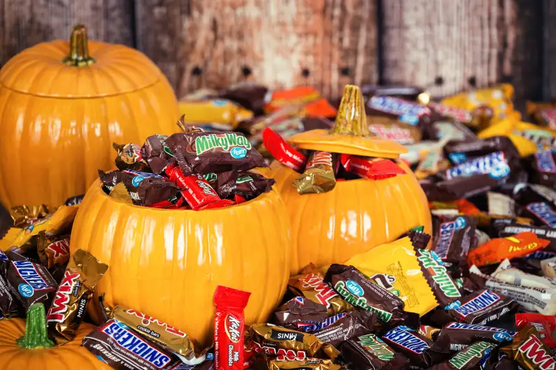 Decorative pumpkins filled with Halloween candy