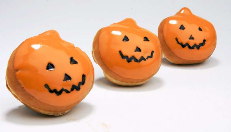 Krispy Kreme's signature doughnut gets a jack-o'-lantern shape and sweet orange frosting for a Halloween treat.