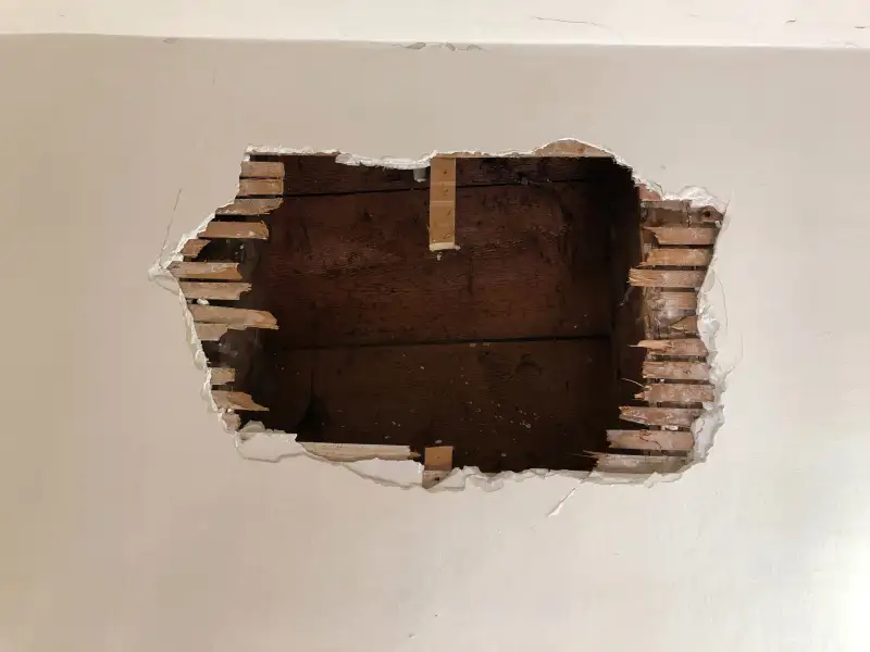 A big hole on the wall in an abandoned building at Vevey, Switzerland