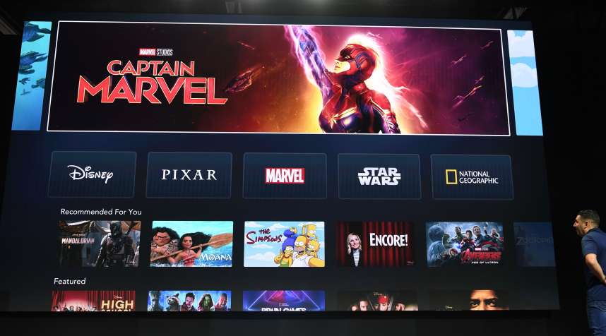 The interface of Disney+ streaming service is displayed on AppleTV at the D23 Expo, billed as the  largest Disney fan event in the world,  on August 23, 2019 at the Anaheim Convention Center in California.