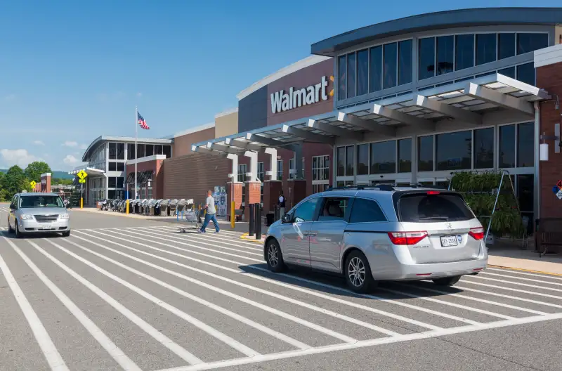 Entrance to large Walmart food supermarket or superstore in Haymarket, Virginia, USA