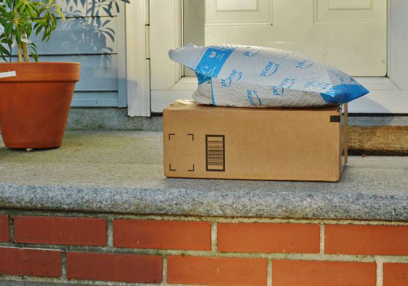 Package Delivery Residential House Amazon Order on Front Doorstep Home