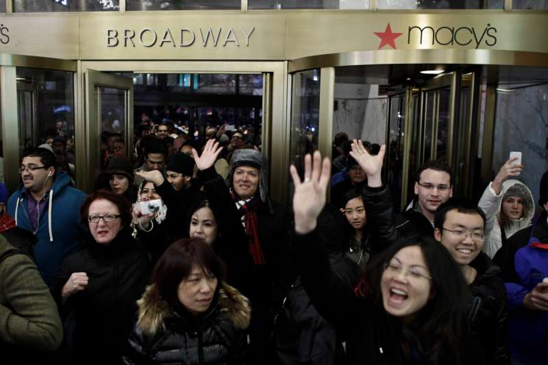 People enter Macy's Herald Square as the store opens on Thanksgiving Day.