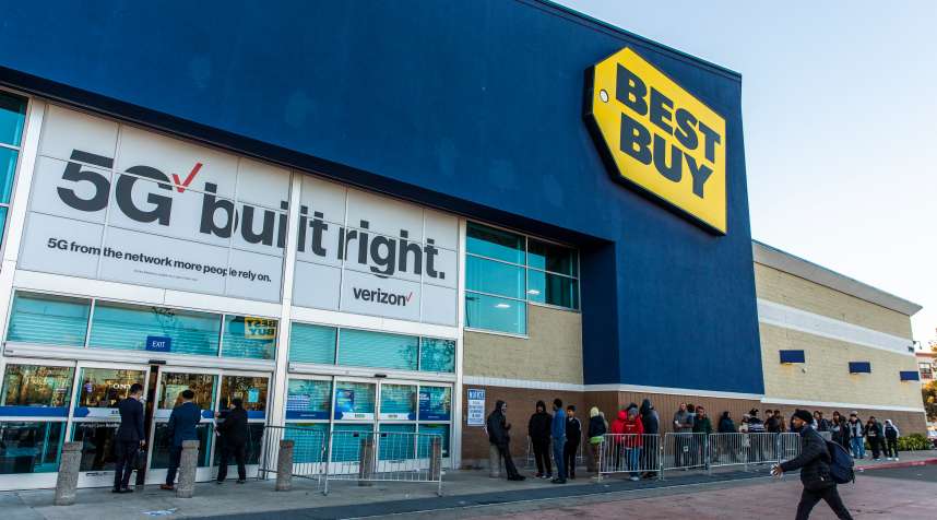 Black Friday shoppers waiting outside a Best Buy store.