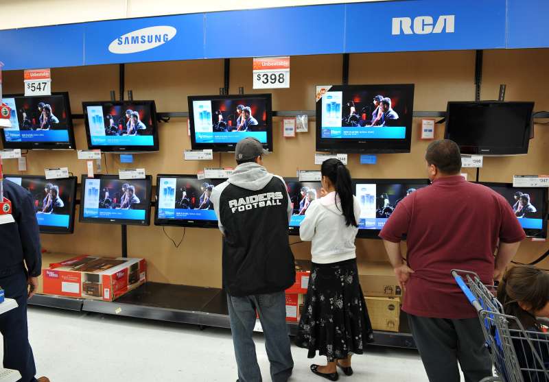 Shoppers browse flat-screen televisions