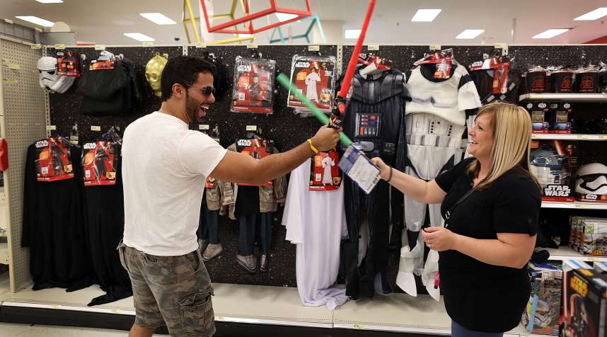 Target shoppers playing with Star Wars toys.