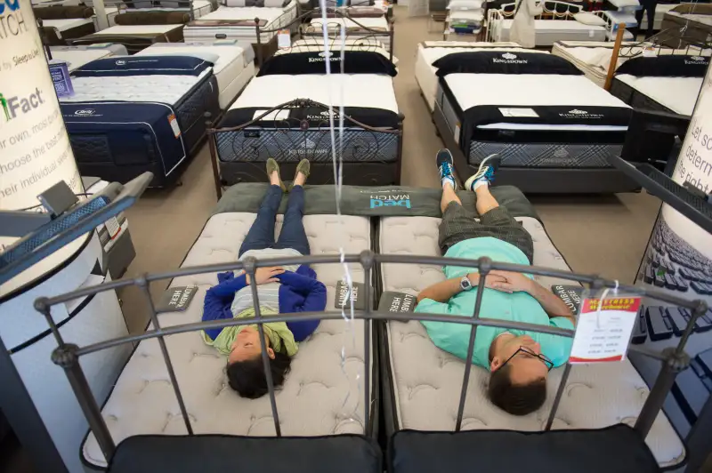 ROCKVILLE MD - MAY 23: Mark and Natalie Tolley mattress shop