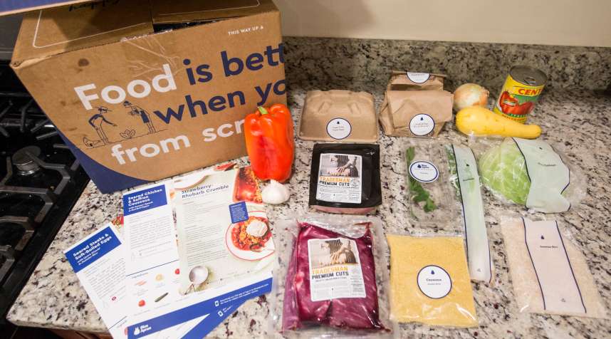 Items from a  family-plan  Blue Apron meal kit box.