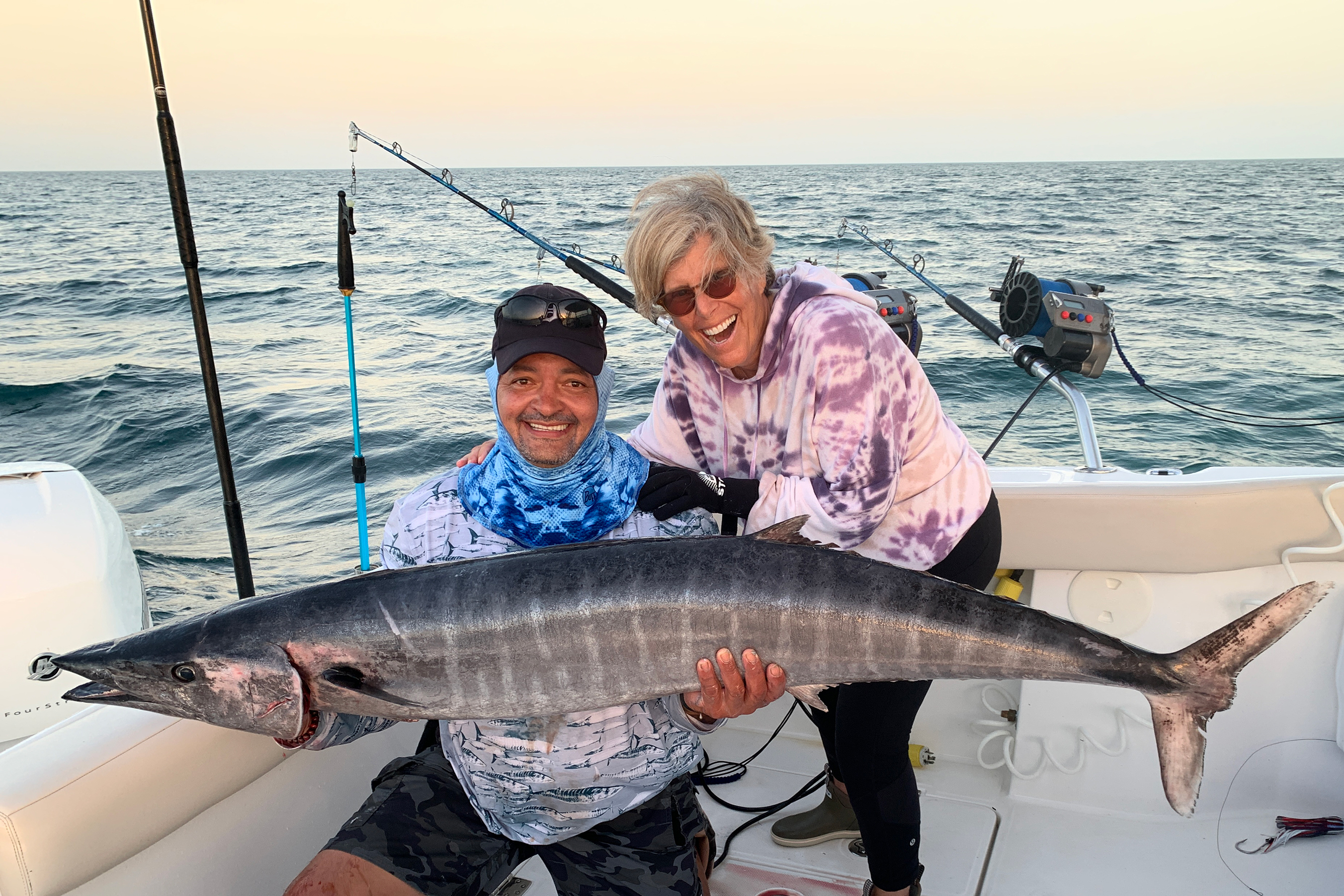 Suze and the 60-pound wahoo she caught.
