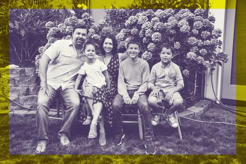 black and white picture of a family with three kids