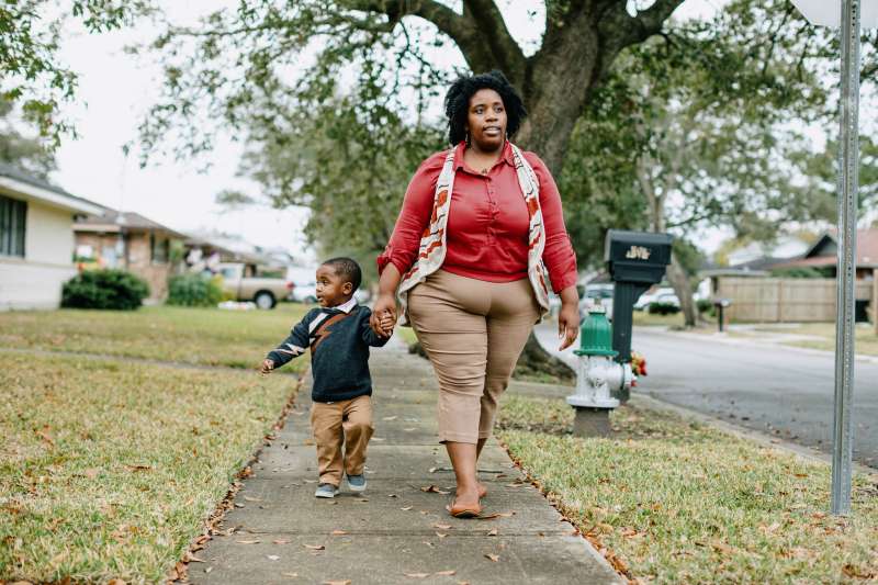 Dasja Reed takes a walk with her with her 2-year-old son, Jarret