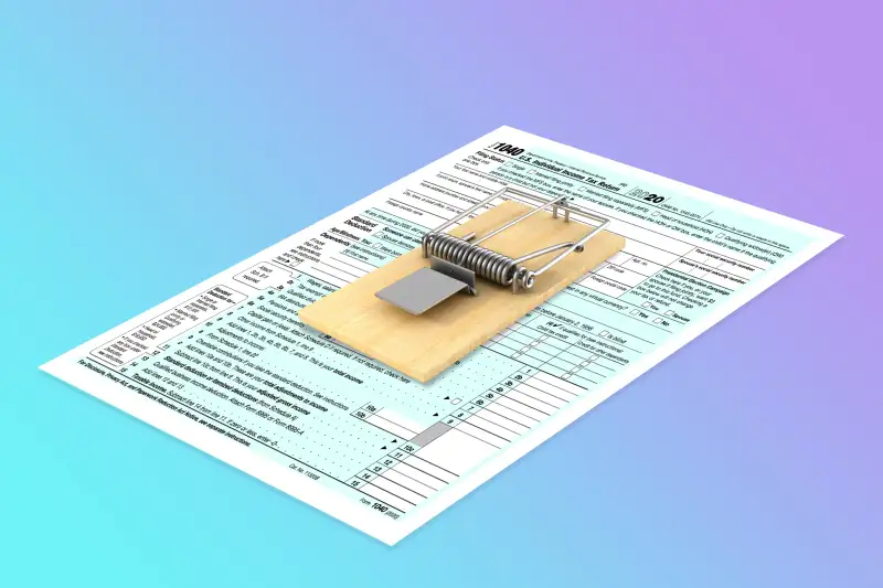 A mouse trap on top of a 1040 form