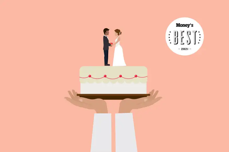 Hands Holding Up A Wedding Cake With A Bride And Groom On Top