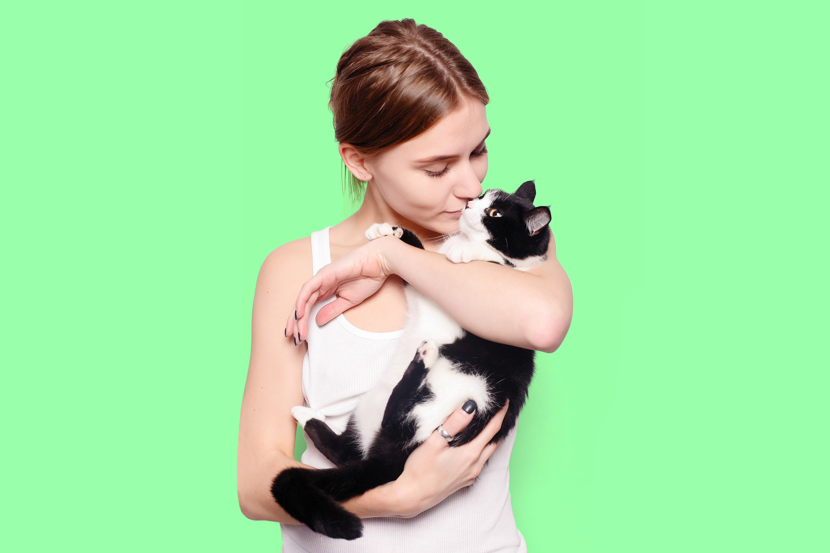 Woman with a cat in her arms