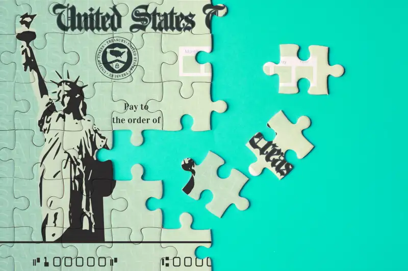 Stimulus check puzzle with a couple of pieces undone