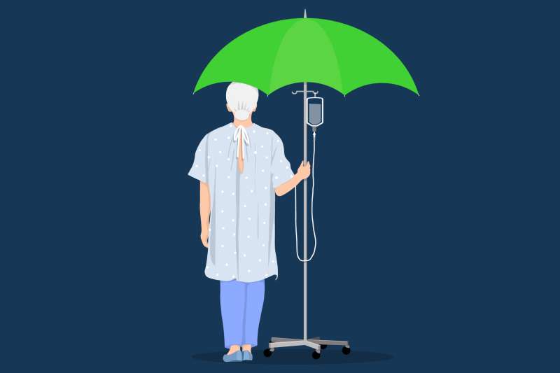 A person walking holding onto an IV drip that forms a green umbrella at the top.