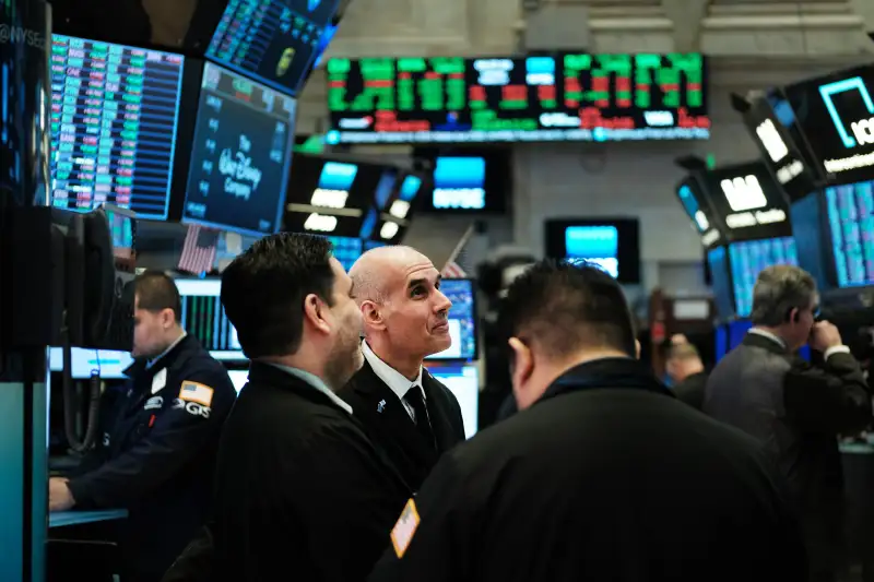 Traders work on the floor of the New York Stock Exchange