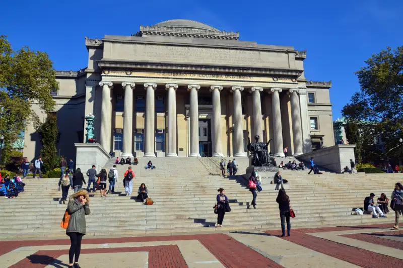 Photograph of students on the steps of the Columbia University Library