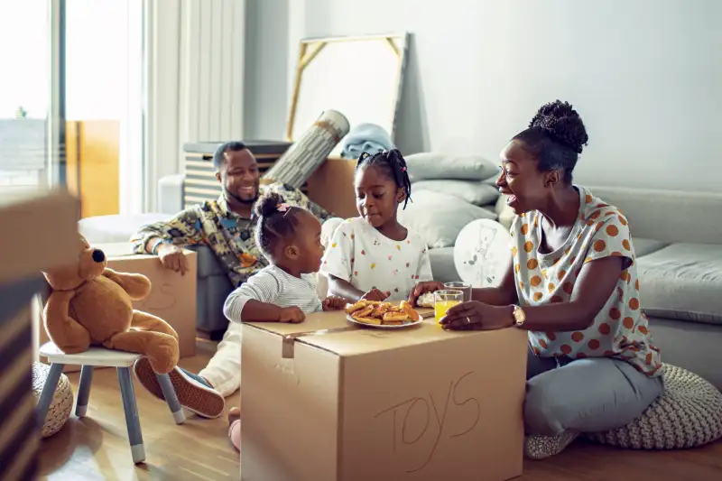 Close up of a young family having breakfast in their new home