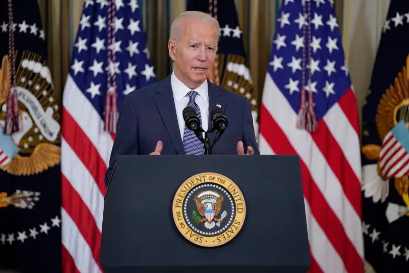 President Joe Biden speaks, at the State Dining Room of the White House, before signing an executive order aimed at promoting competition in the economy