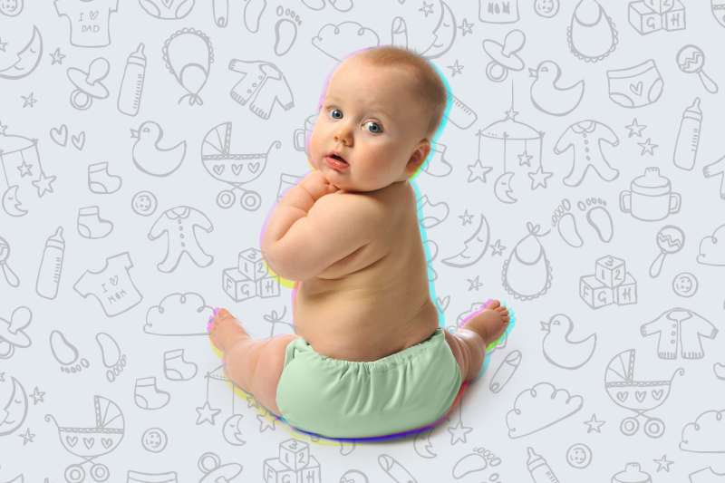 Baby wearing a cloth diaper over a background with baby icon drawings