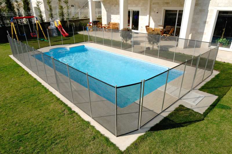 Backyard pool with a safety net around it